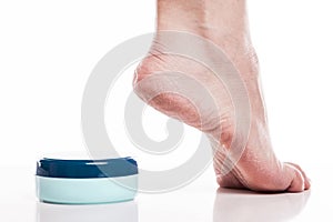 Care for dry skin on the well-groomed feet and heels with creams