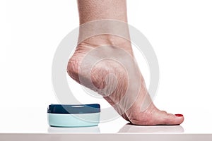 Care for dry skin on the well-groomed feet and heels with creams