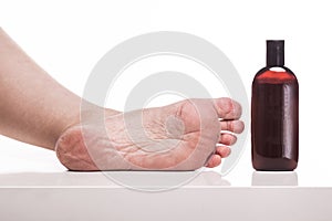 Care for dry skin on the well-groomed feet and heels with creams