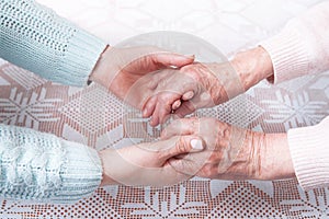 Care is at home of elderly. Senior woman with their caregiver at home. Concept of health care for elderly old people