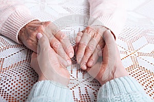 Care is at home of elderly. Senior woman with their caregiver at home. Concept of health care for elderly old people