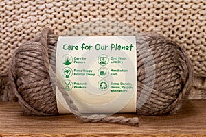 Care for our planet label on ball of wool with eco care icons and text