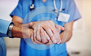 Care, support and a doctor holding hands with a man for healthcare, help and service. Caregiver, love and closeup of a