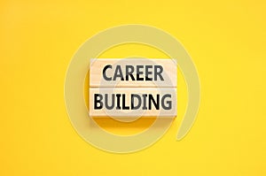 Career building symbol. Concept words Career building on beautiful wooden block. Beautiful yellow table yellow background.