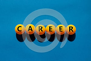 Career and business symbol. The concept word `career` on orange table tennis balls on a beautiful blue background. Business and