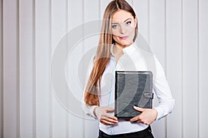 Young woman office worker hold case with files.