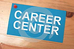 Career center, text words typography written on paper against wooden background, life and business motivational inspirational