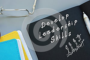 Career concept meaning Develop Leadership Skills with phrase on the piece of paper