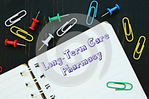 Career concept meaning Long-Term Care Pharmacy with sign on the piece of paper