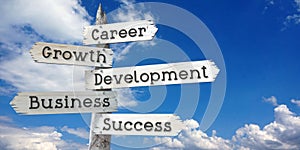 Career, development, growth, business, success - wooden signpost with five arrows