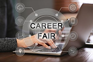 Career fair. Woman working with laptop at table