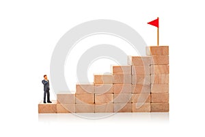Career ladder. Steps up as symbol of the path to the goal. Man in suit stands at the beginning of the path to successful