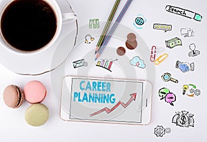 Career Planning Business Concept. Mobile phone and coffee cup on a white office desk