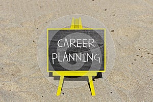 Career planning symbol. Concept words Career planning on beautiful black chalk blackboard. Beautiful sea sand beach background.