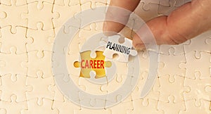 Career planning symbol. Concept words Career planning on beautiful white paper puzzle. Beautiful yellow background. Businessman