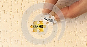 Career planning symbol. Concept words Career planning on beautiful white paper puzzle. Beautiful yellow background. Businessman