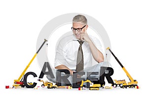 Career start up: Businessman building career-word.