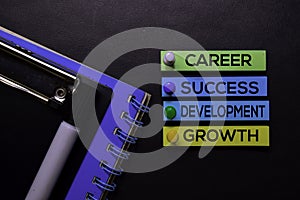 Career, Success, Development, Growth text on sticky notes isolated on Black desk. Mechanism Strategy Concept