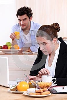 Career woman eating breakfast