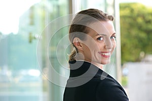 Career woman smiling outside