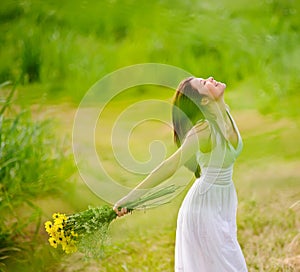 Carefree attractive girl in field photo