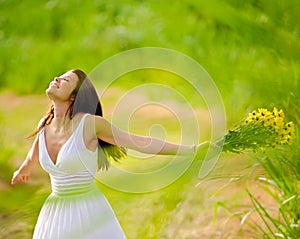 Carefree attractive girl in field photo