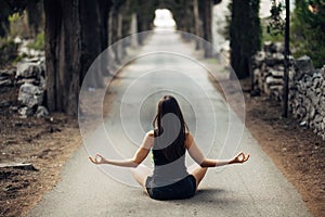 Carefree calm woman meditating in nature.Finding inner peace.Yoga practice.Spiritual healing lifestyle.Enjoying peace,anti-stress photo