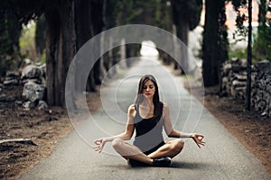 Carefree calm woman meditating in nature.Finding inner peace.Yoga practice.Spiritual healing lifestyle.Enjoying peace,anti-stress photo