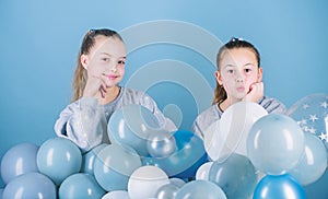 Carefree childhood. Sisters organize home party. Having fun concept. Balloon theme party. Girls best friends near air