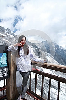 Carefree Chinese beauty on Yunnan Jade dragon snow mountain