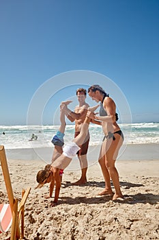 Carefree fun in the sun. a happy family having fun together at the beach.
