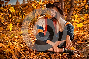 Carefree girl in autumn park