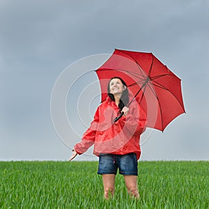 Carefree girl enjoying rain shower outdoors