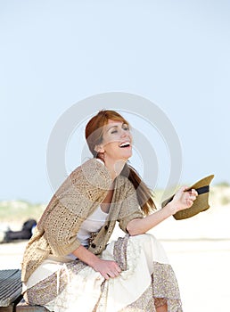 Carefree middle aged woman smiling outdoors