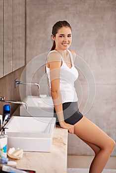 Carefree perfection. Portrait of a beautiful young woman standing in her bathroom.