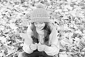 Carefree and relaxed. Autumn skin care routine. Kid wear warm knitted hat. Warm woolen accessory. Girl relaxing autumn