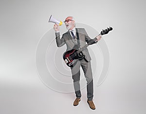 Carefree senior businessman singing over megaphone and playing electric guitar on white background