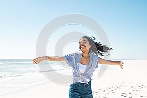 Carefree smiling woman enjoy the summer at beach