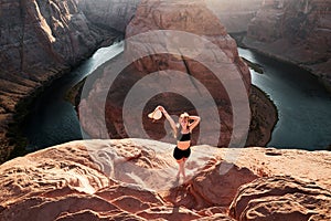 Carefree tourist woman on Grand canyon. Young Woman enjoying view of Horseshoe bend. Canyon Adventure Travel Relax