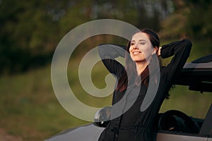 Happy Female Tourist Driver Next to Her Car