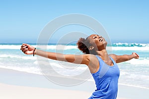 Carefree woman having a good time at beach