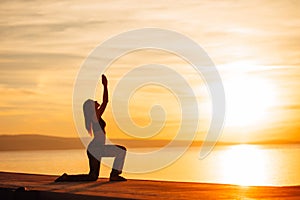 Carefree woman meditating in nature.Finding inner peace.Yoga practice.Spiritual healing lifestyle.Enjoying peace,anti-stress photo