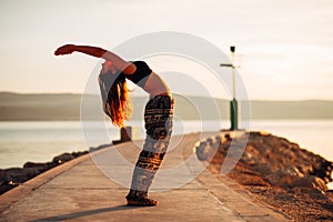 Carefree woman meditating in nature.Finding inner peace.Yoga practice.Spiritual healing lifestyle.Enjoying peace,anti-stress