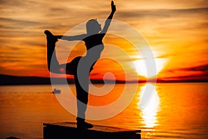 Carefree woman meditating in nature.Finding inner peace.Yoga practice.Spiritual healing lifestyle.Enjoying peace,anti-stress photo