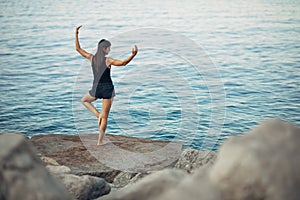 Carefree woman meditating in nature.Finding inner peace.Yoga practice.Spiritual healing lifestyle.Enjoying peace,anti-stress