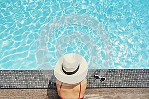 Carefree woman relaxation in swimming pool summer Holiday concept