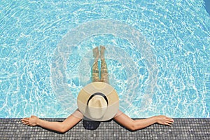 Carefree woman relaxation in swimming pool summer Holiday concept