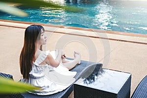 Carefree woman relaxation in swimming pool summer Holiday concept