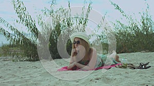 Carefree woman in summer dress relaxing at beach