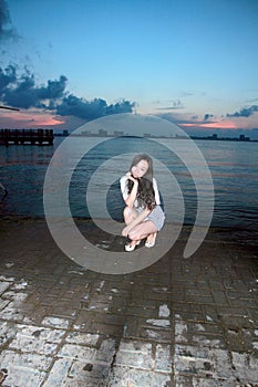 Carefree woman in the sunset by Dishui lake in Shanghai, healthy living concept, pure happiness and freedom